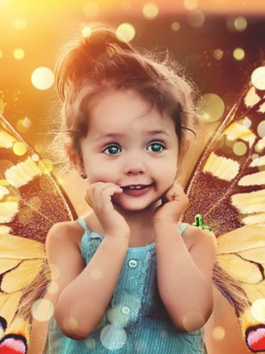 Awestruck toddler, eyes filled with wonder, wearing butterfly wings.