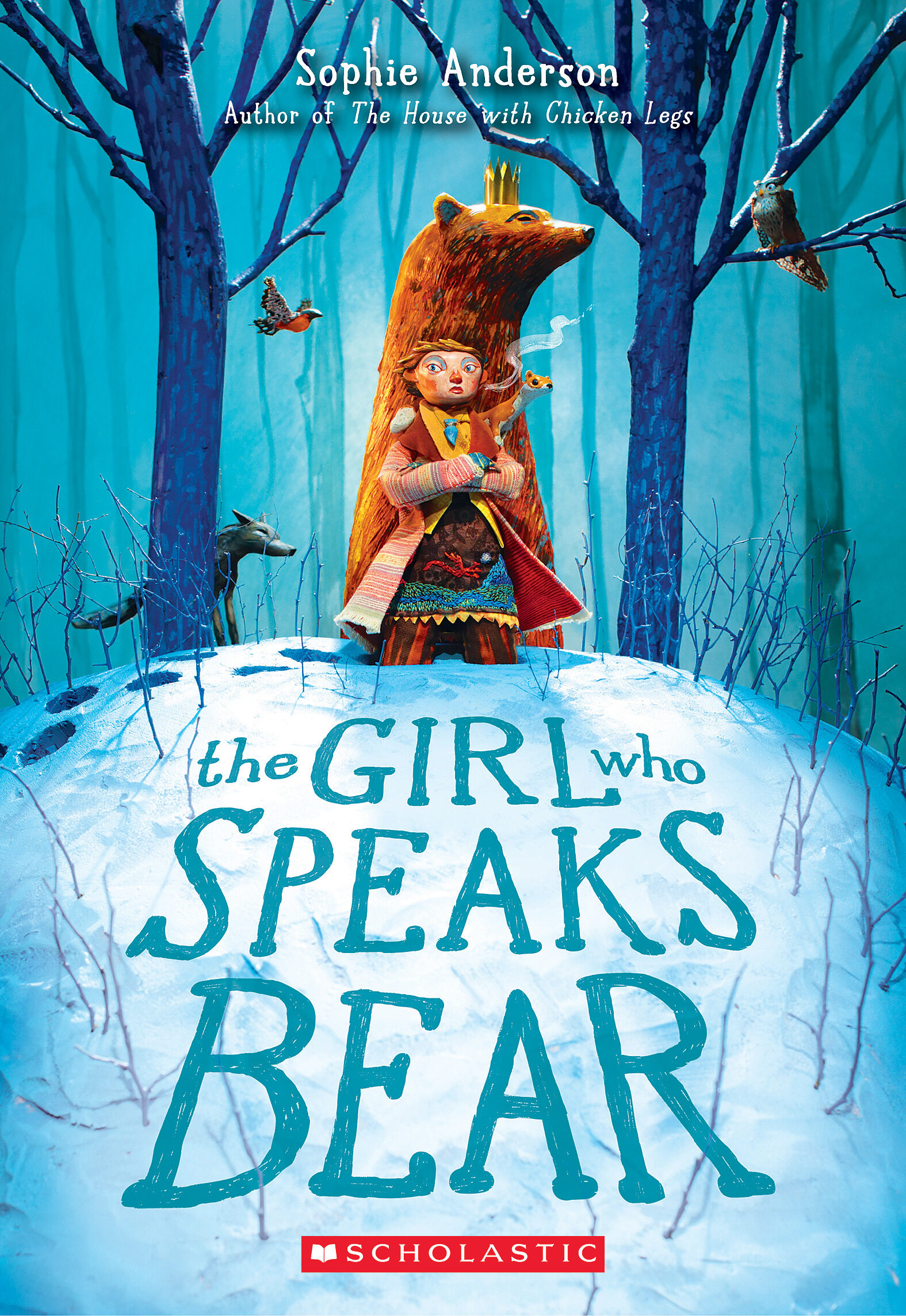 A book cover showing an animated and strapping young girl hiding behind a bear in a cold, blue, winter forest.