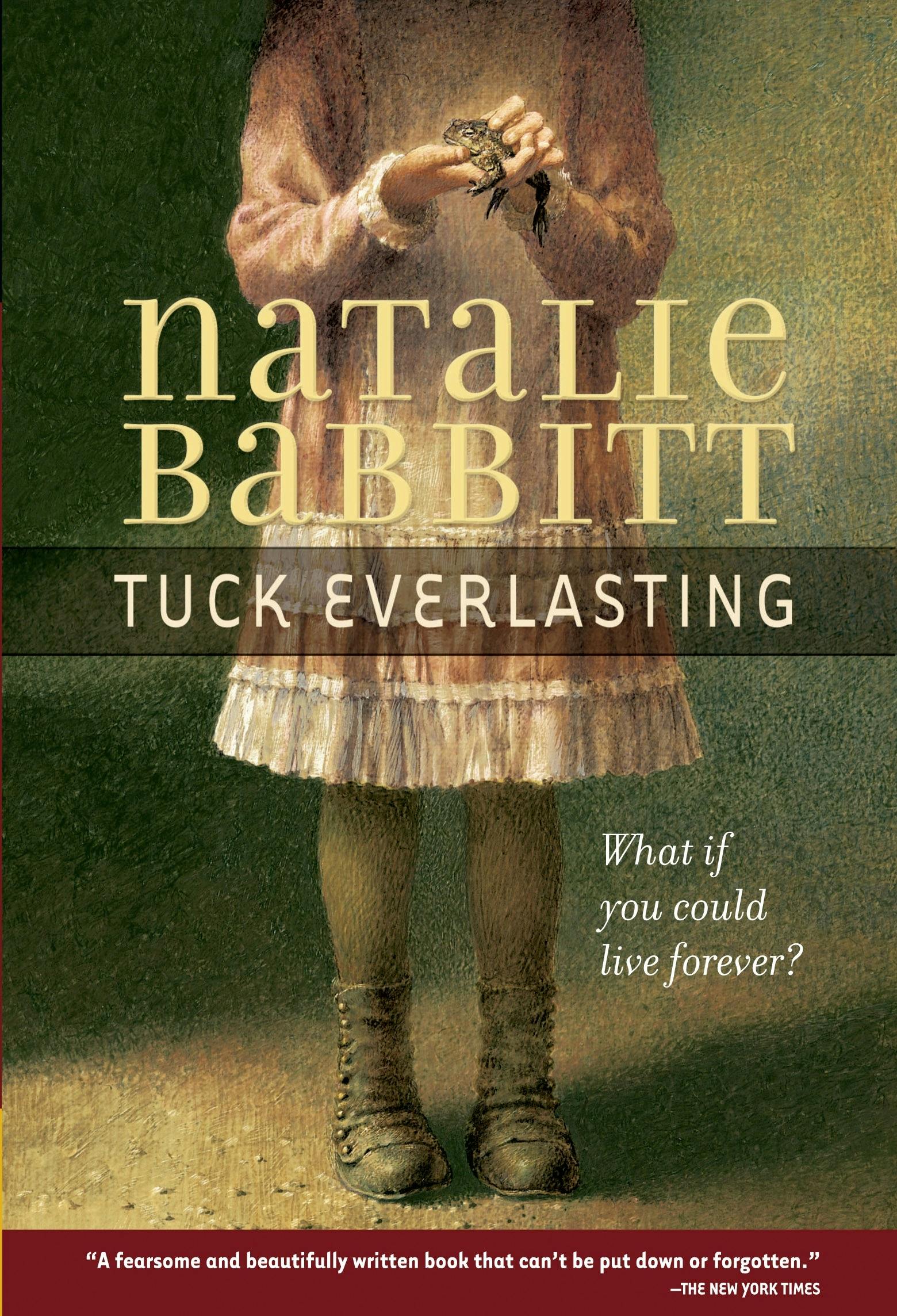 A girl holding a frog and wearing an old-fashioned dress and boots is shown from the neck down.