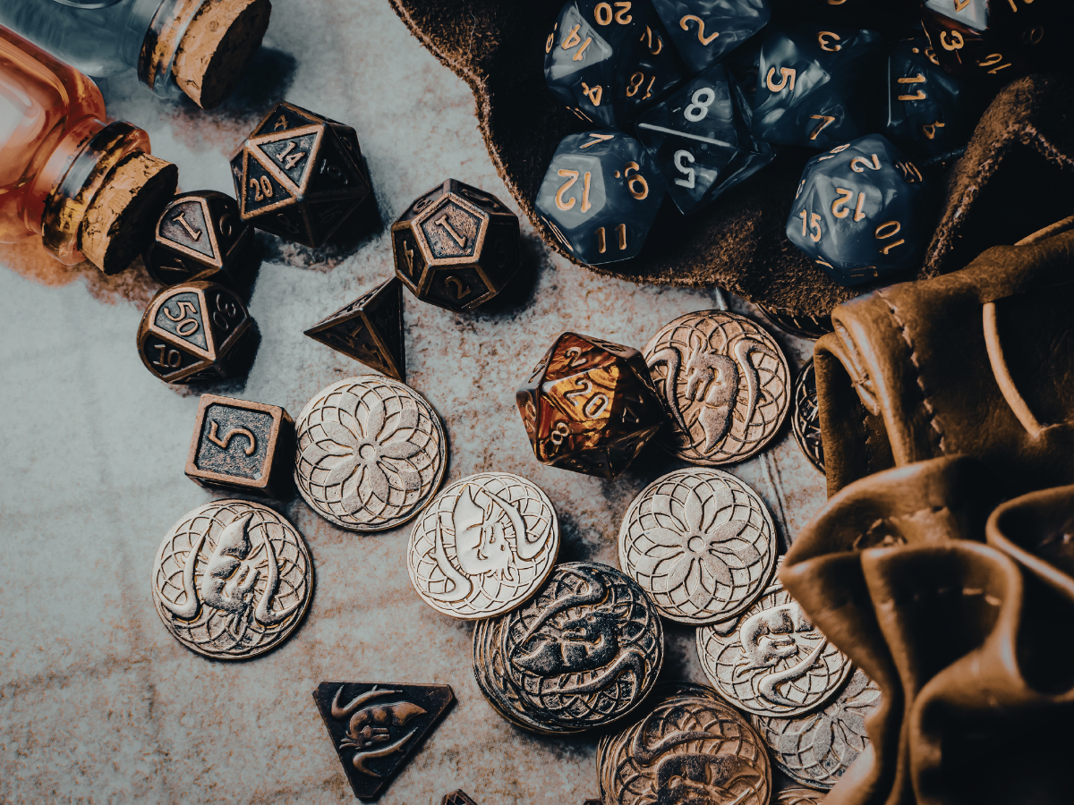 dice and coins scattered on tabletop