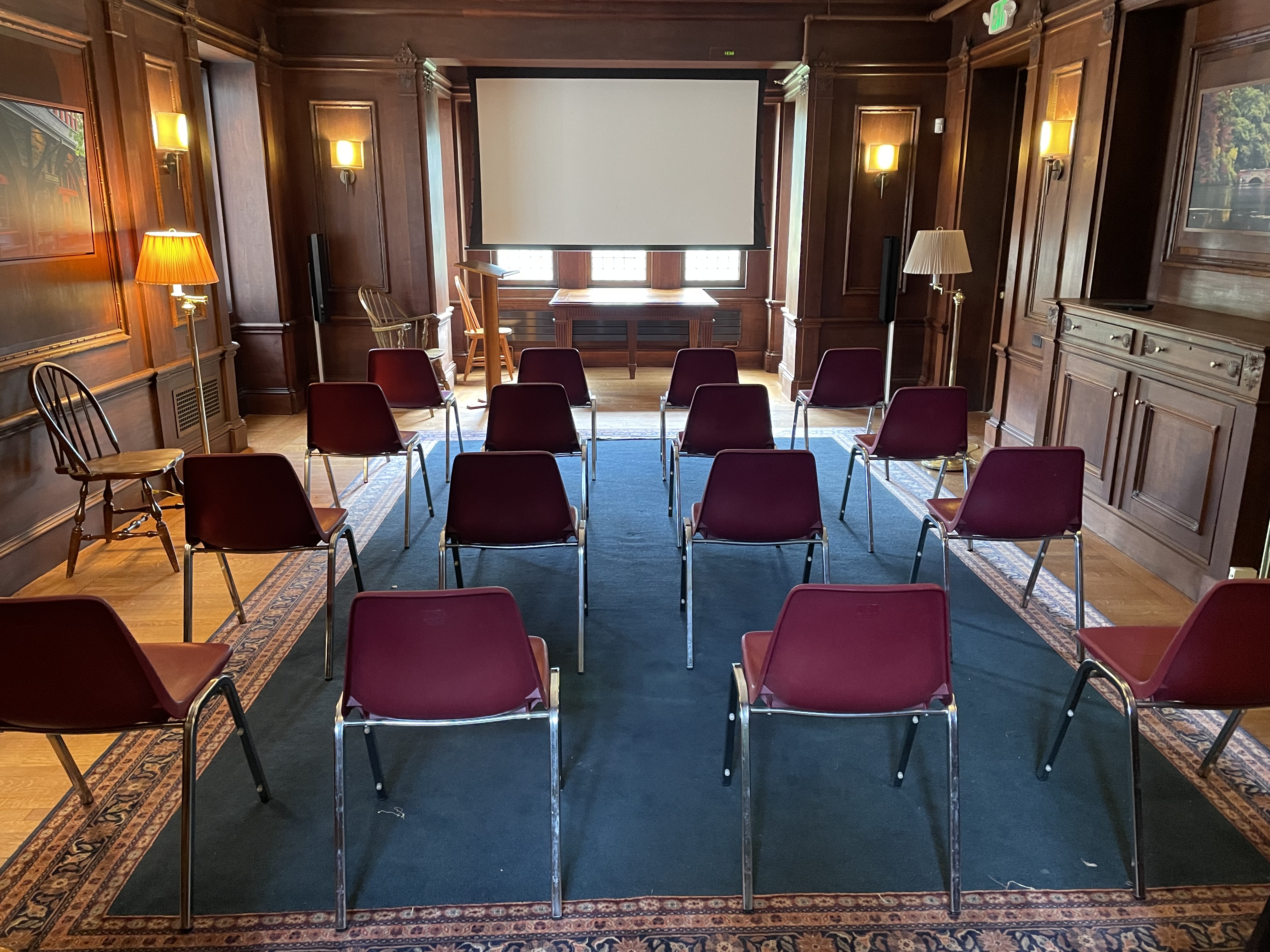 audience in rows with screen