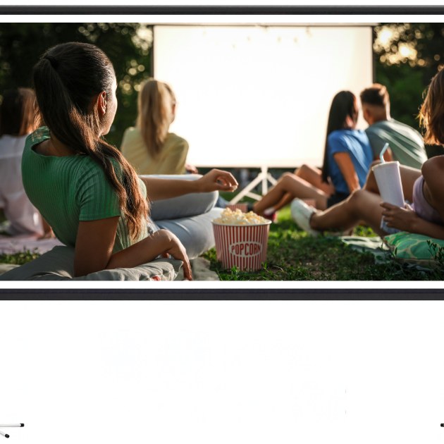 people watching an outdoor projector screen