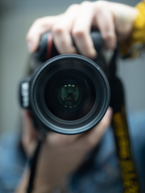 Person pointing camera towards reader