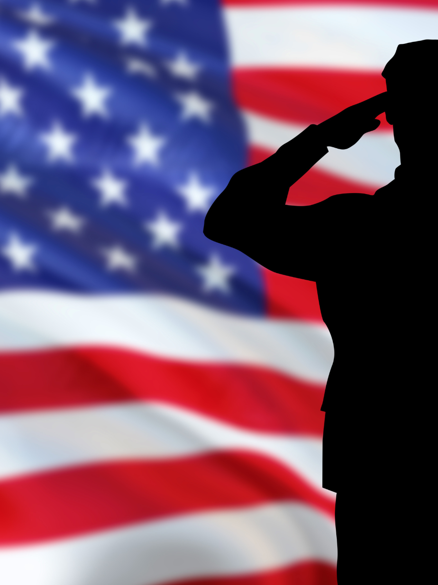 Silhouette of Veteran saluting American flag