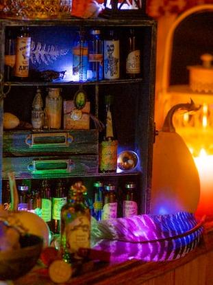 A multi-colored apothecary shelf glows menacingly.