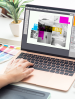 laptop showing graphic design on screen
