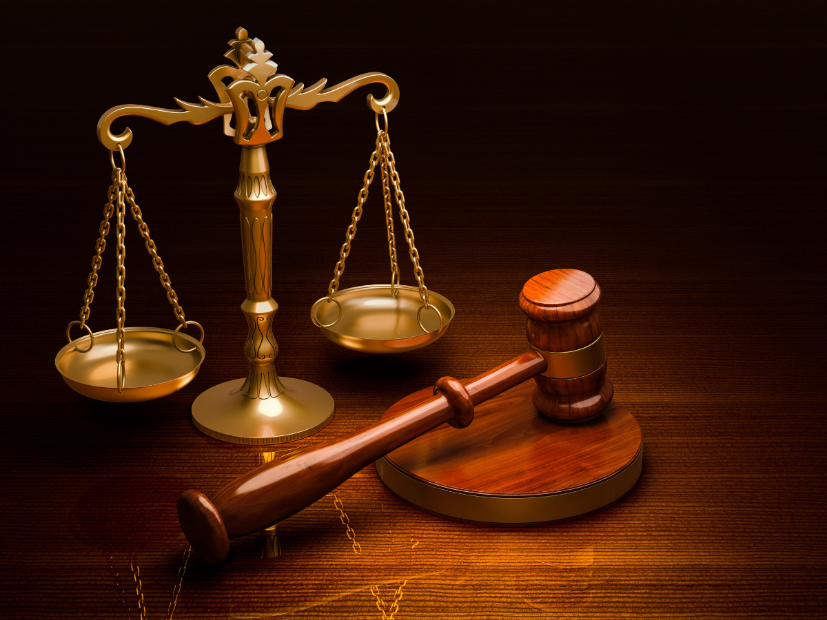 gold scales with wooden gavel