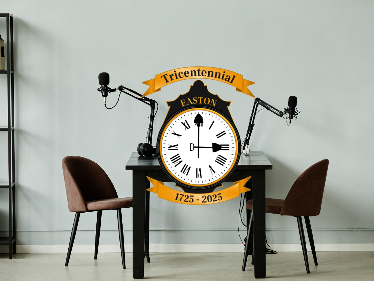 Table with a chair and microphone on either side. Easton's Tricentennial logo sits in the foreground of the image.