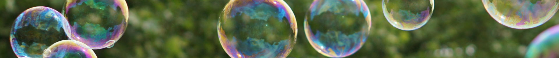 Bubbles float against a leafy green background.